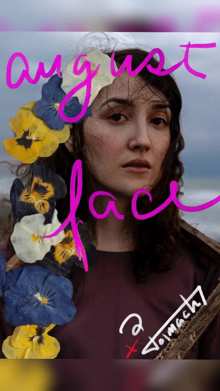 Woman's face with flowers and hand-written title August Face